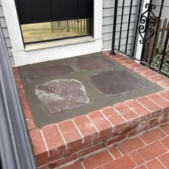 Brick landing with flagstone inlay at a side entry