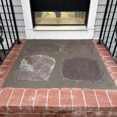 Front view of the brick and flagstone landing