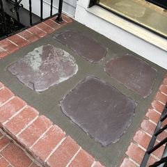 Flagstone inlay set into the brick landing