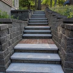 Granite treads and brick landing between the walls