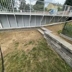 Above ground pool set into the regraded yard